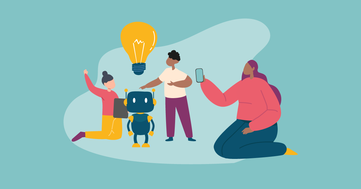 Gruppe von Menschen um einen Roboter versammelt, eine hält ein Smartphone, eine andere eine Glühbirne.